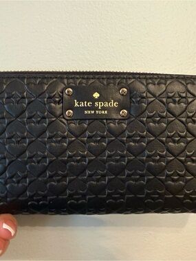 kate spade black spade-embossed zip around wallet with gold logo